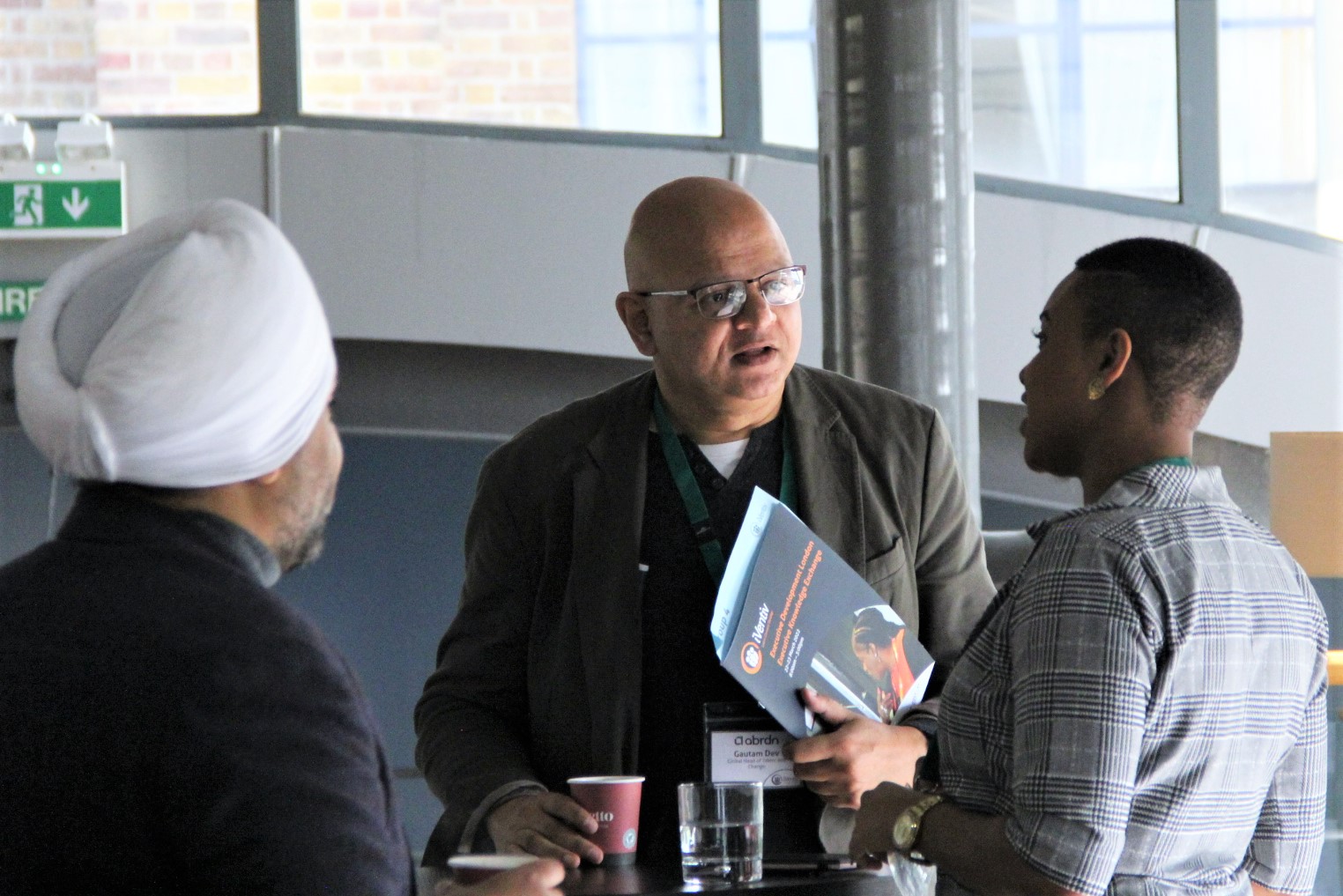 Three participants in conversation at iVentiv's Executive Development London in 2022